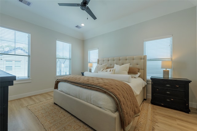 bedroom featuring multiple windows and ceiling fan