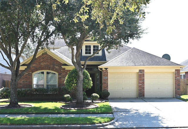 view of front facade with a garage and a front yard