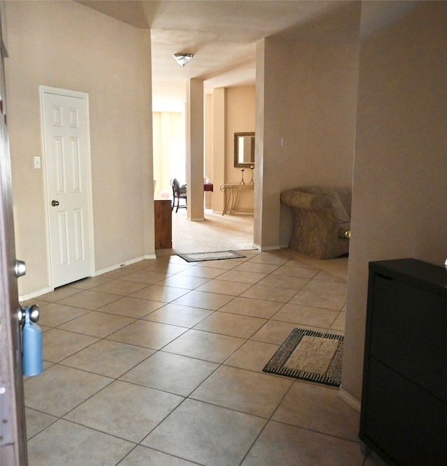 hall with light tile patterned flooring