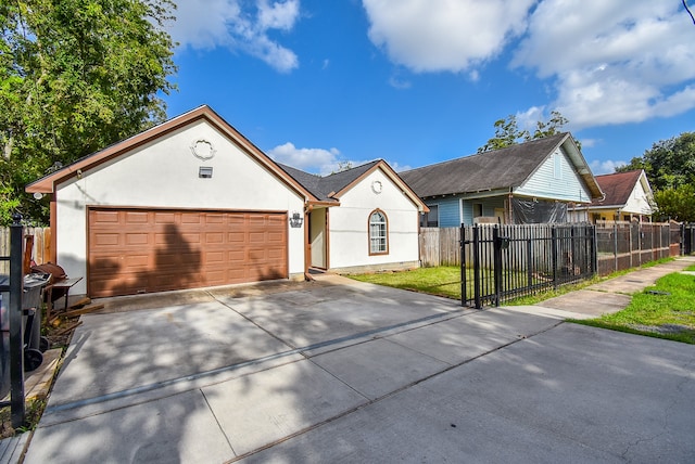 view of front of house with a front lawn and a garage