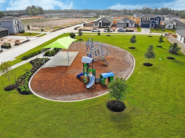 view of home's community with a lawn and a playground