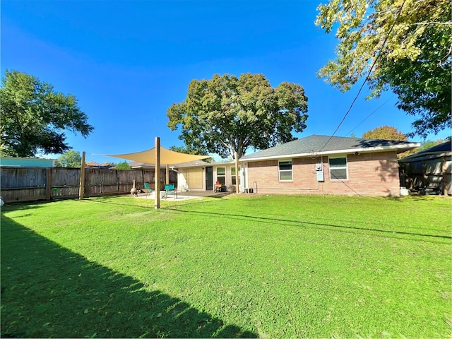 rear view of property with a patio area and a lawn