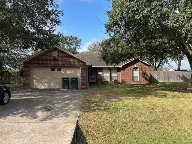 ranch-style home with a garage and a front lawn