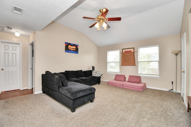 living room featuring ceiling fan, carpet, and lofted ceiling