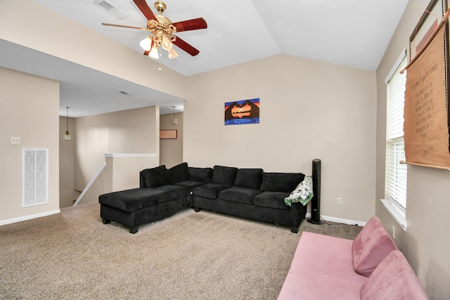 carpeted living room featuring ceiling fan and lofted ceiling