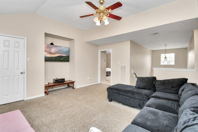 living room with carpet flooring, ceiling fan, and vaulted ceiling