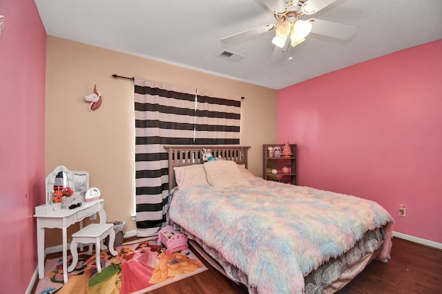 bedroom featuring dark hardwood / wood-style floors and ceiling fan