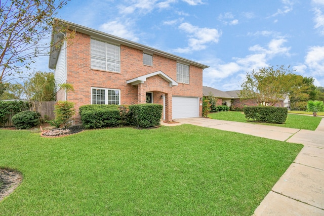 view of front of home featuring a front yard and a garage