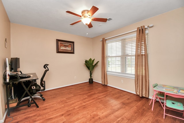 office space featuring ceiling fan and hardwood / wood-style flooring