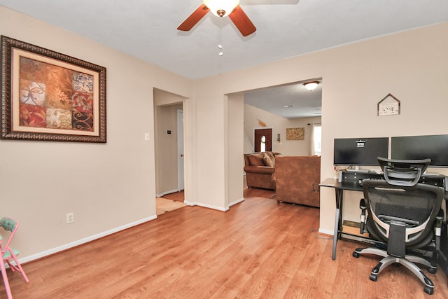 office area with light wood-type flooring and ceiling fan