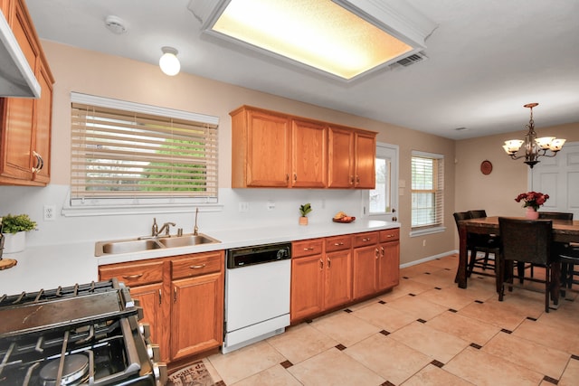 kitchen featuring a wealth of natural light, dishwasher, an inviting chandelier, and sink