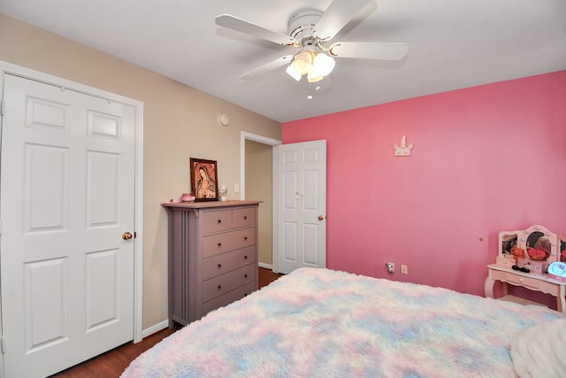 bedroom featuring dark hardwood / wood-style flooring and ceiling fan