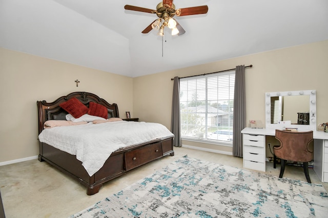 carpeted bedroom with ceiling fan and lofted ceiling