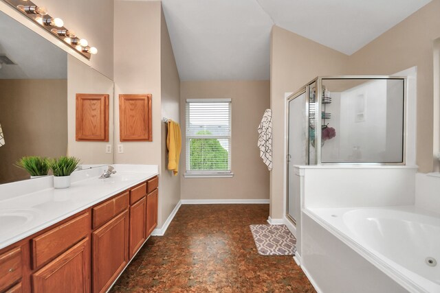 bathroom featuring vanity, separate shower and tub, and lofted ceiling