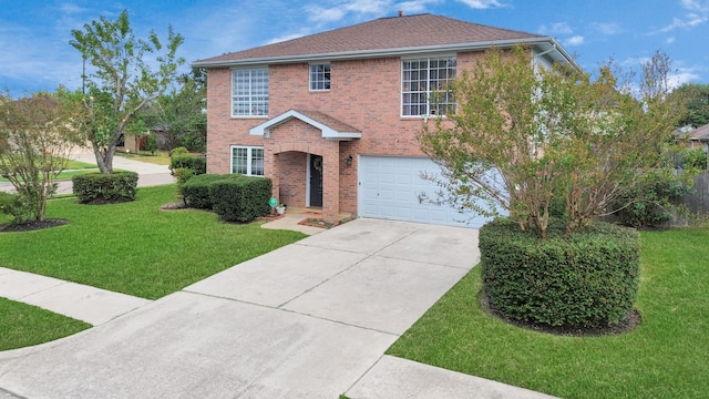 view of front facade featuring a front yard and a garage