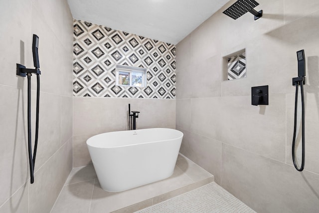 bathroom featuring tile walls, shower with separate bathtub, and tile patterned flooring