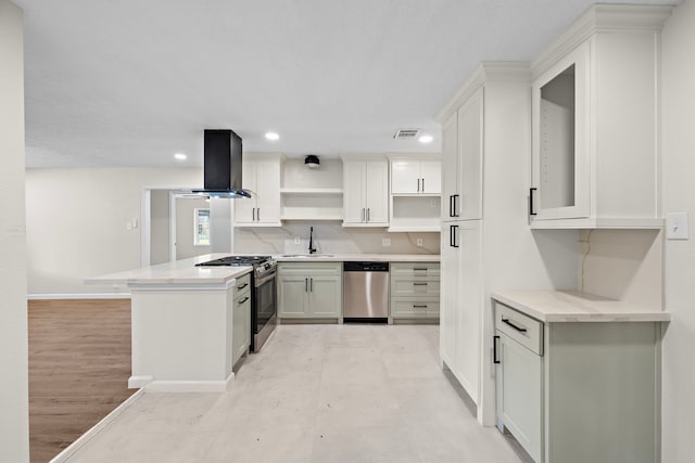 kitchen with white cabinetry, stainless steel appliances, kitchen peninsula, and island range hood