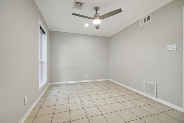 tiled spare room featuring ornamental molding and ceiling fan