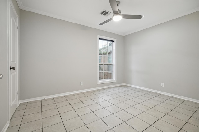 spare room featuring crown molding, ceiling fan, and light tile patterned floors