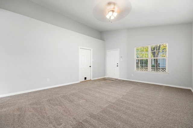 carpeted empty room with ceiling fan