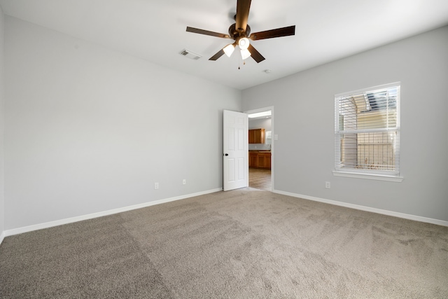 unfurnished bedroom with light carpet and ceiling fan