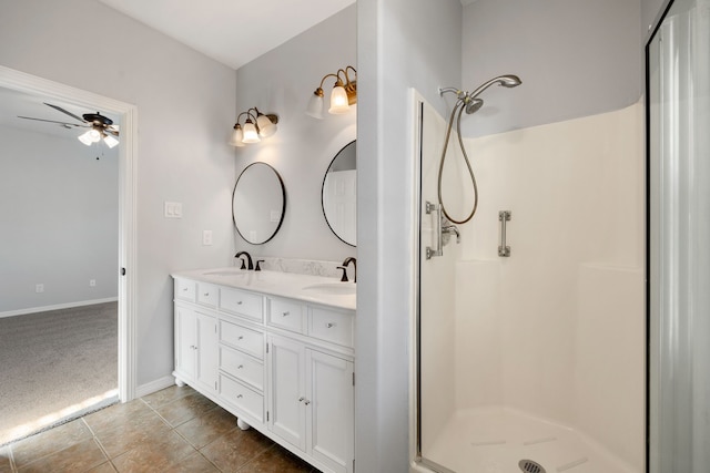 bathroom with vanity, ceiling fan, tile patterned floors, and walk in shower