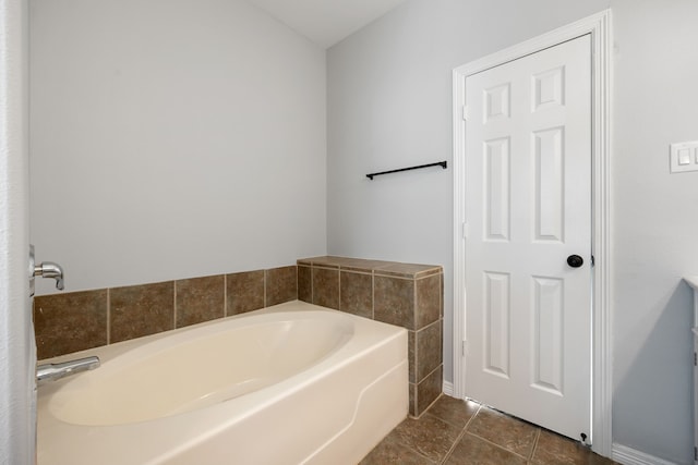 bathroom featuring tile patterned flooring and a bathing tub