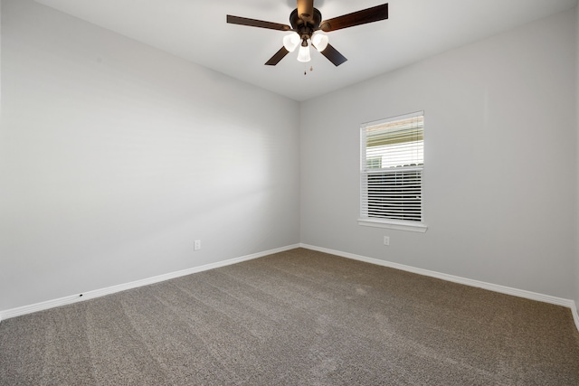 spare room featuring carpet floors and ceiling fan