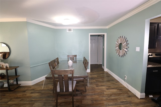 dining space with ornamental molding and dark hardwood / wood-style floors