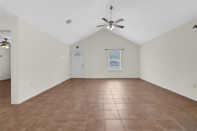 tiled empty room with lofted ceiling and ceiling fan