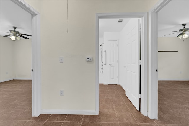 hall featuring tile patterned flooring