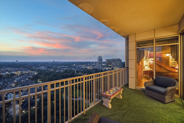 view of balcony at dusk