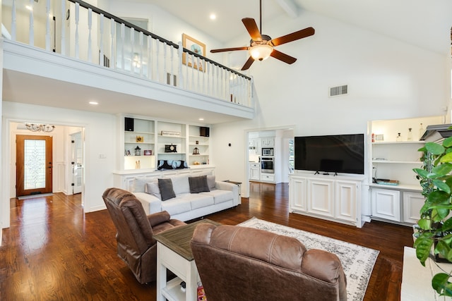 living room featuring beamed ceiling, dark wood-type flooring, and high vaulted ceiling