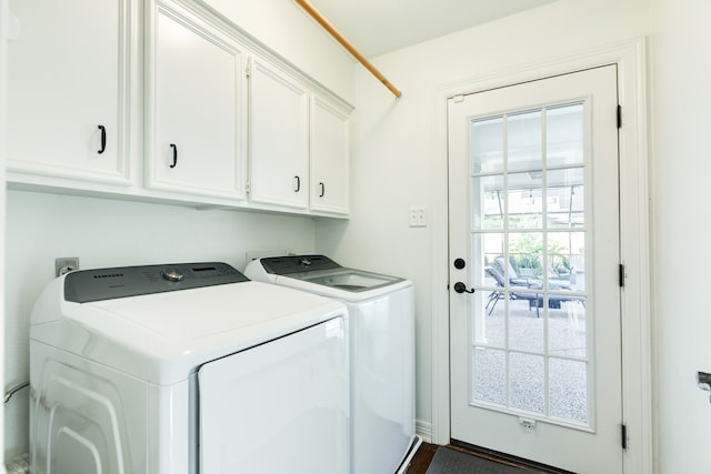 laundry room with cabinets, washing machine and dryer, and a wealth of natural light