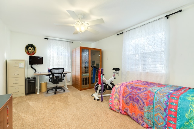 bedroom featuring ceiling fan and light colored carpet