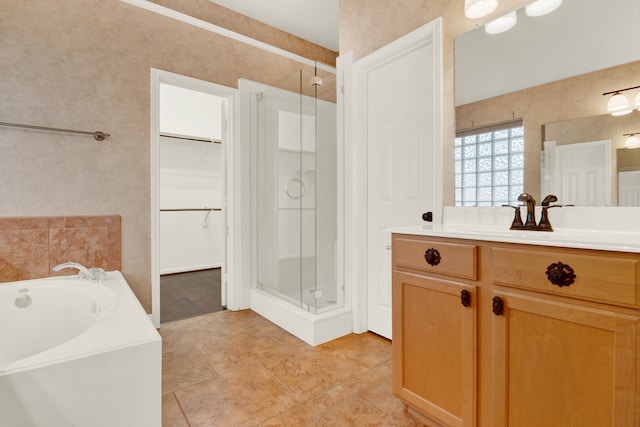 bathroom with vanity, independent shower and bath, and tile patterned floors