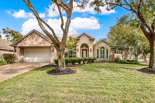 view of front of home with a front lawn and a garage