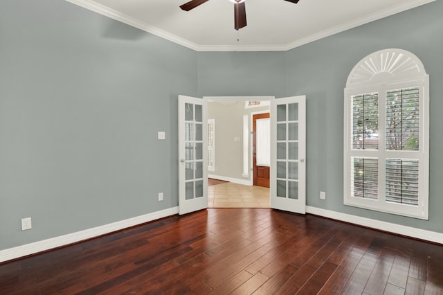 empty room featuring french doors, crown molding, ceiling fan, and hardwood / wood-style floors