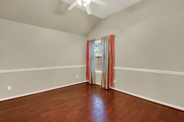 unfurnished room with vaulted ceiling, ceiling fan, and dark hardwood / wood-style flooring