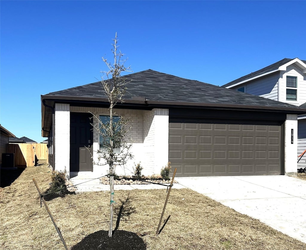 ranch-style home featuring a garage