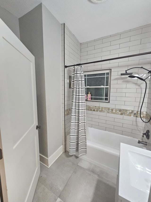 bathroom with vanity and shower / bath combination with curtain