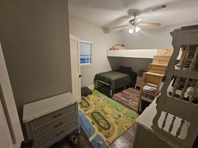 bedroom featuring dark wood-type flooring and ceiling fan