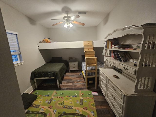 bedroom featuring dark wood-type flooring and ceiling fan