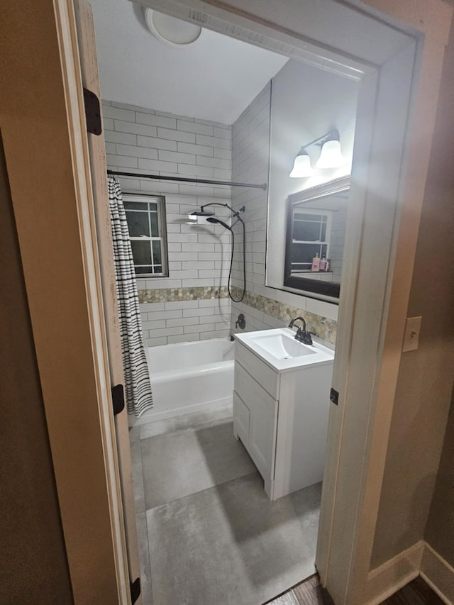 bathroom featuring vanity, tile patterned floors, and shower / tub combo