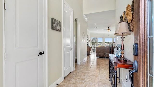 hall featuring light tile patterned flooring