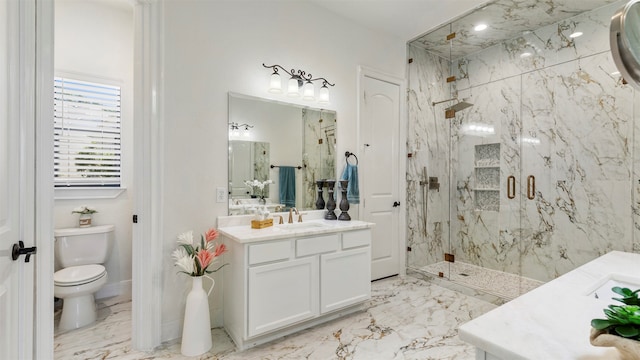 bathroom featuring vanity, toilet, and walk in shower