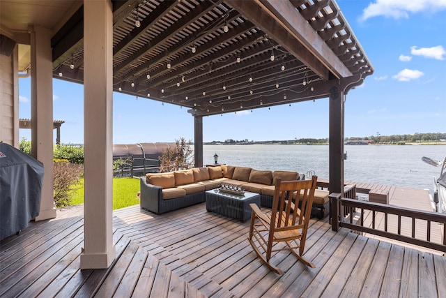 wooden terrace featuring a water view and an outdoor hangout area