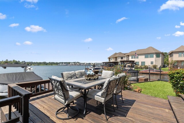 wooden terrace featuring a water view