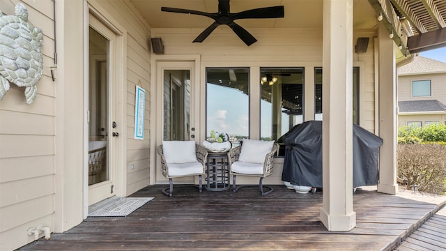 deck with area for grilling and ceiling fan