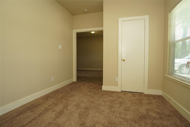 unfurnished room featuring carpet floors